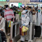 Photos show thousands packing into cars, planes, and trains in a rush to get out of Wuhan as China lifts the coronavirus lockdown
