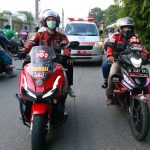 Indonesian bikers brave COVID-19 surge to escort ambulances