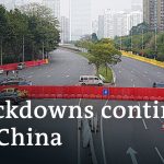China slightly relaxes quarantine rules, shutdowns of cities and factories continue | DW News